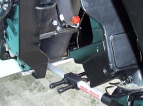 The back of the transom mount forms the back and the pin forms the bottom of the cradle